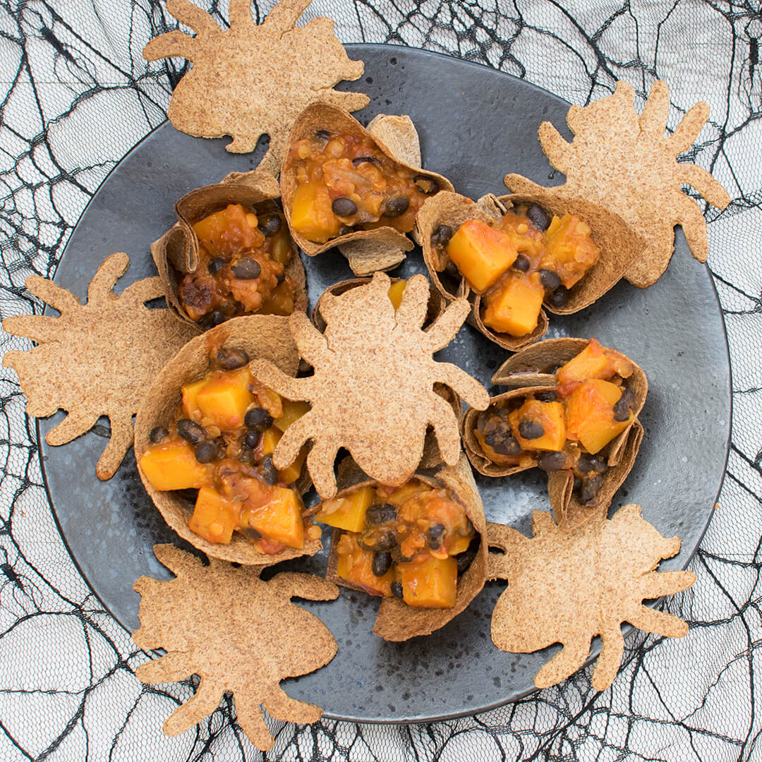 Butternut & Lentil Hot Pot served in a wholemeal wrap with a spider shaped tortilla wrap crisp