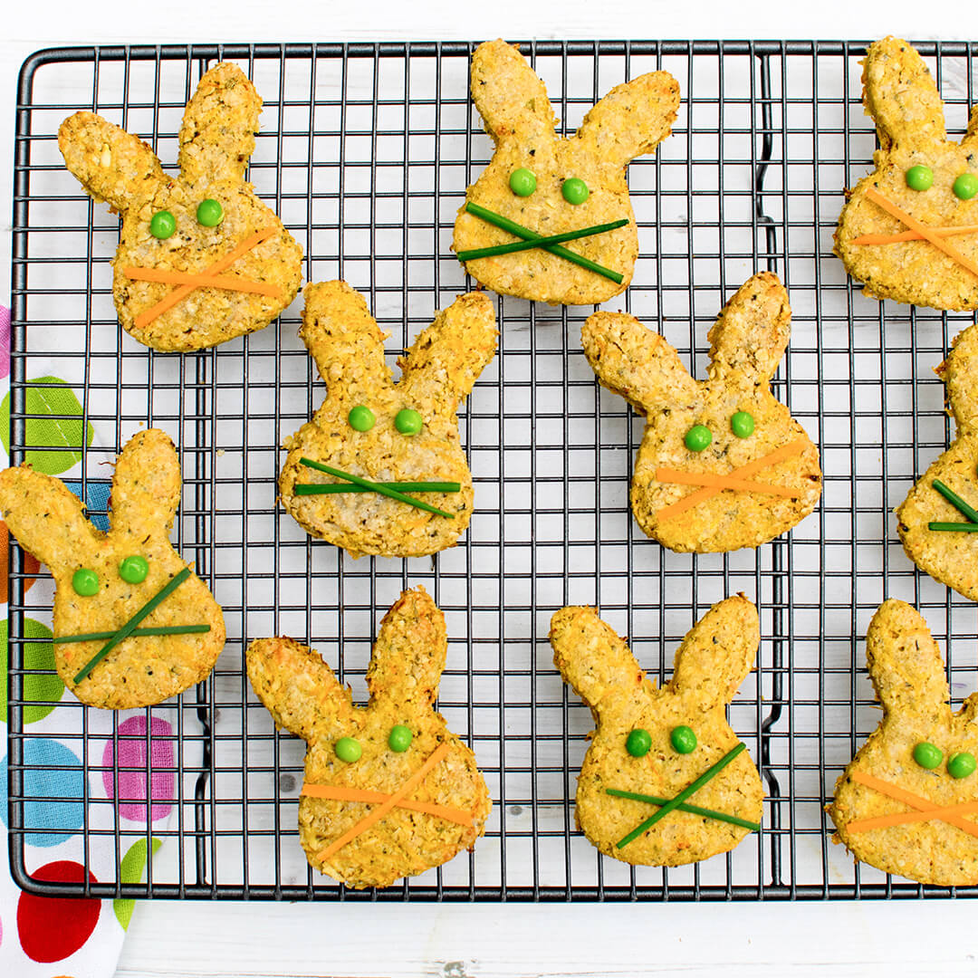 Bunny shaped Carrot, Cheese & Oat Biscuits with peas for eyes and carrot shavings or chives for whiskers