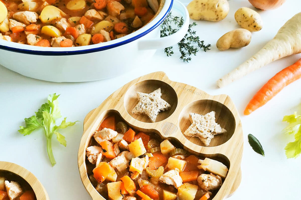 A serving of Baby Chicken Casserole next to a casserole dish of Baby Chicken Casserole