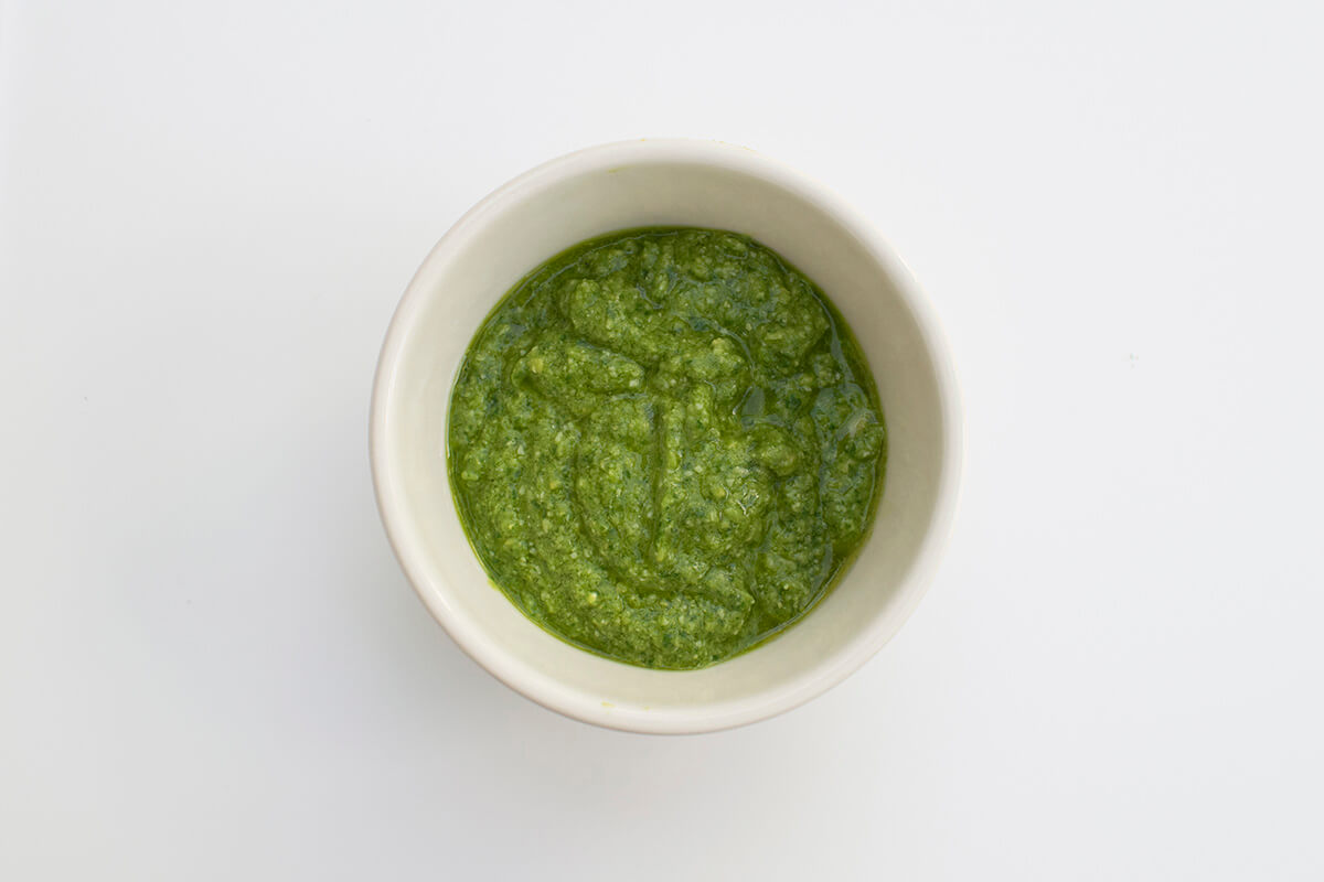 A bowl of green pesto