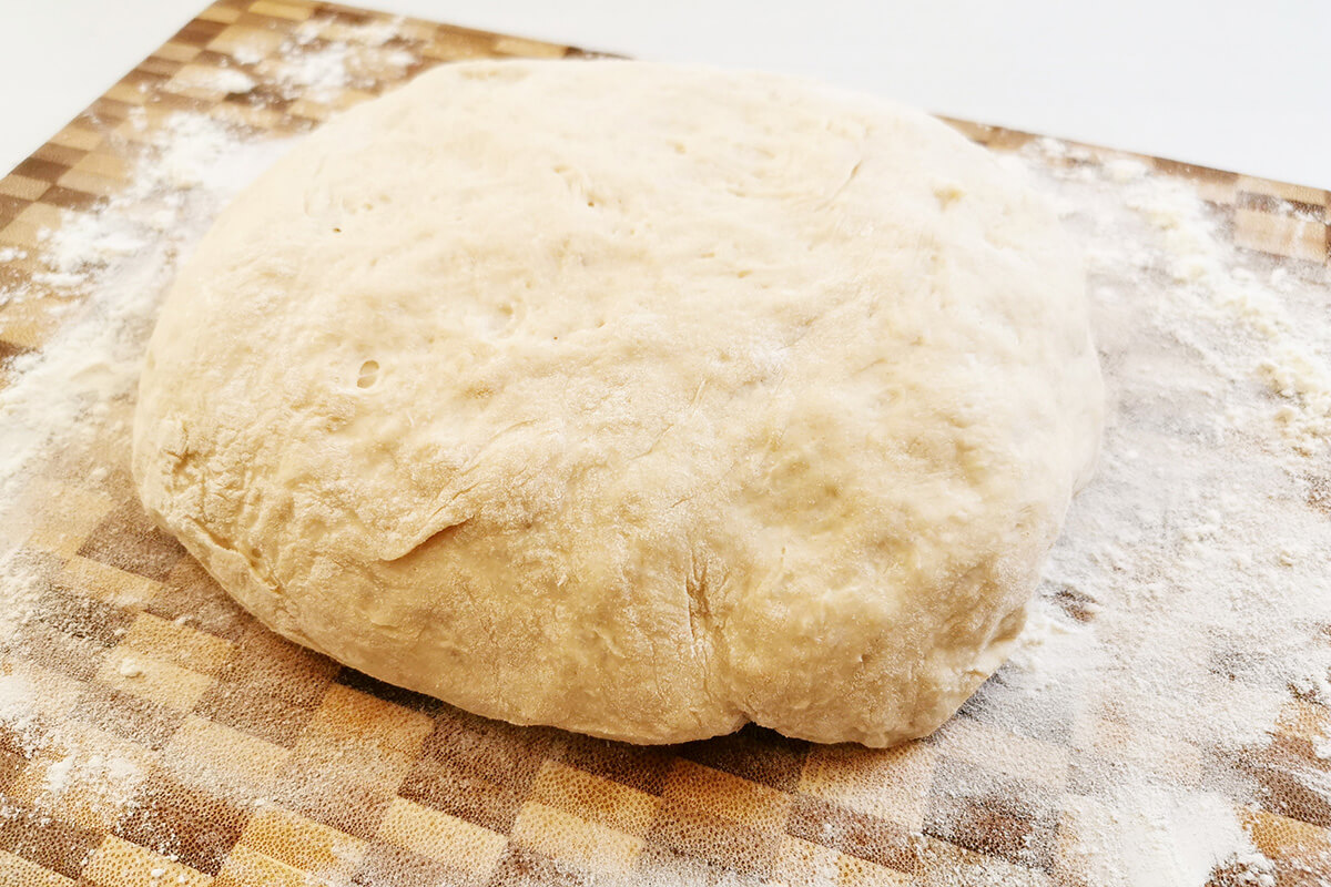 Ball of dough on a floured work surface