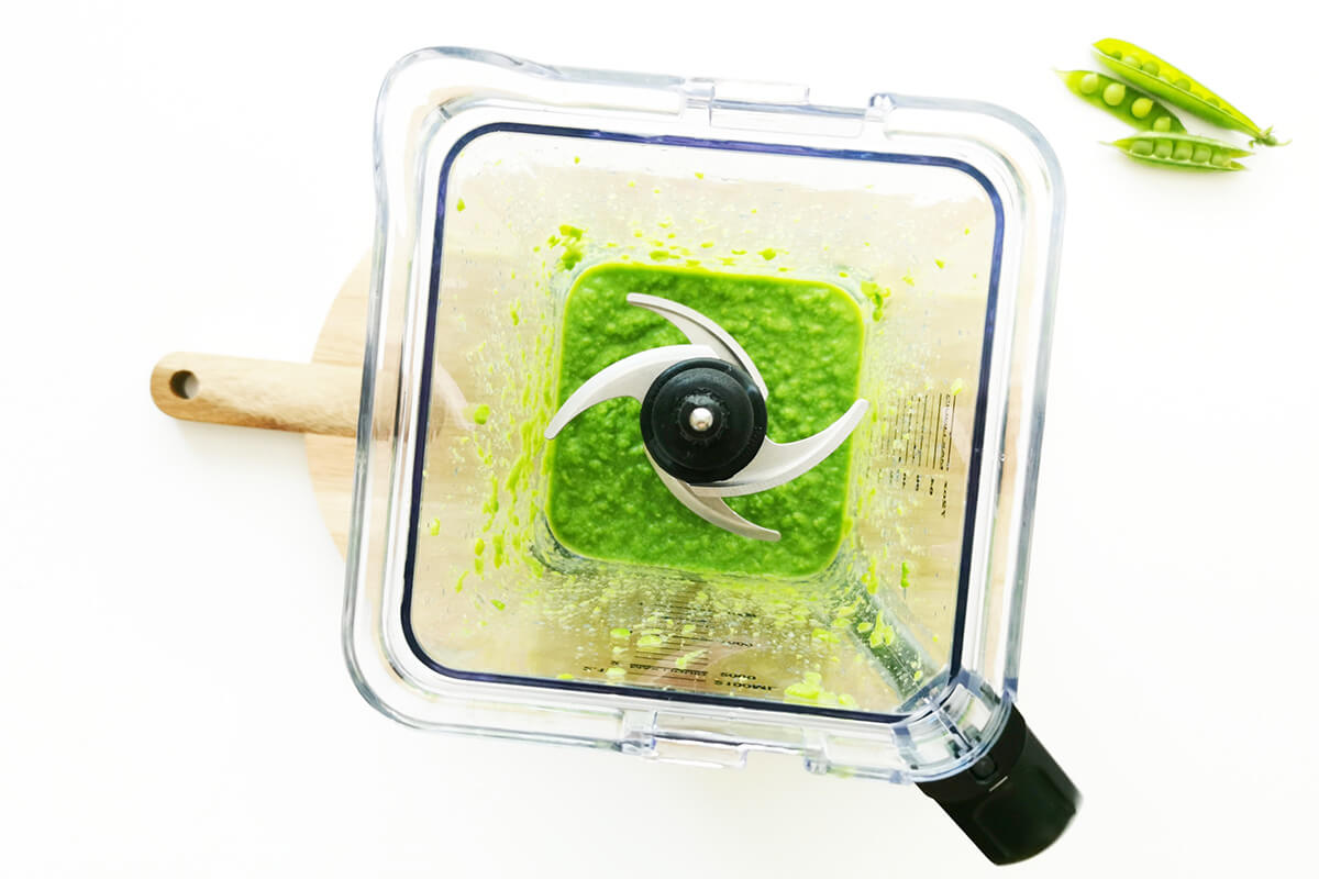 Peas being blended in a blender